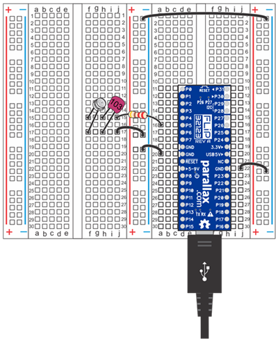 Propeller FLiP on a prototyping breadboard with a phototransistor circuit.